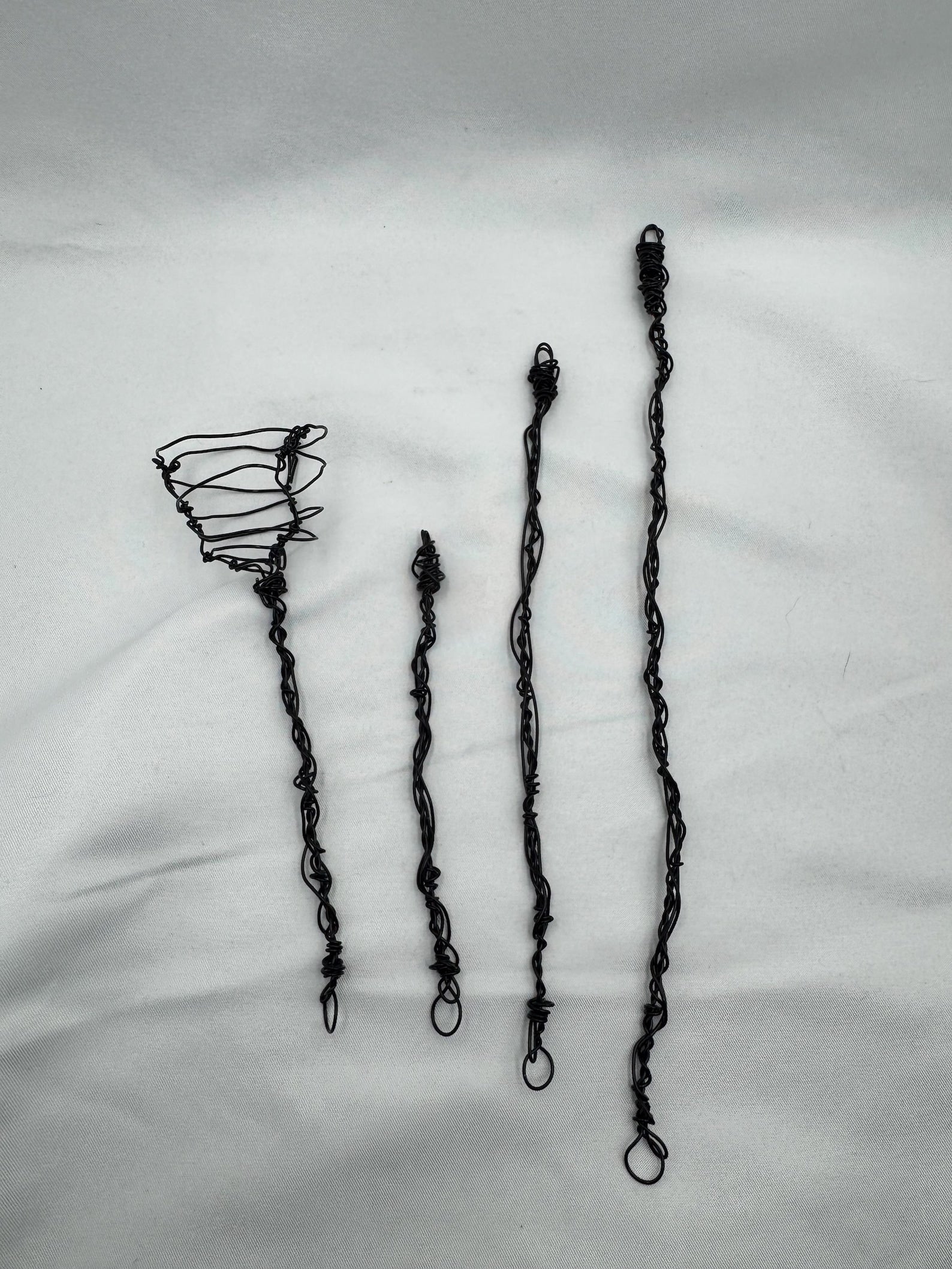 Black symbiote webs on white backdrop