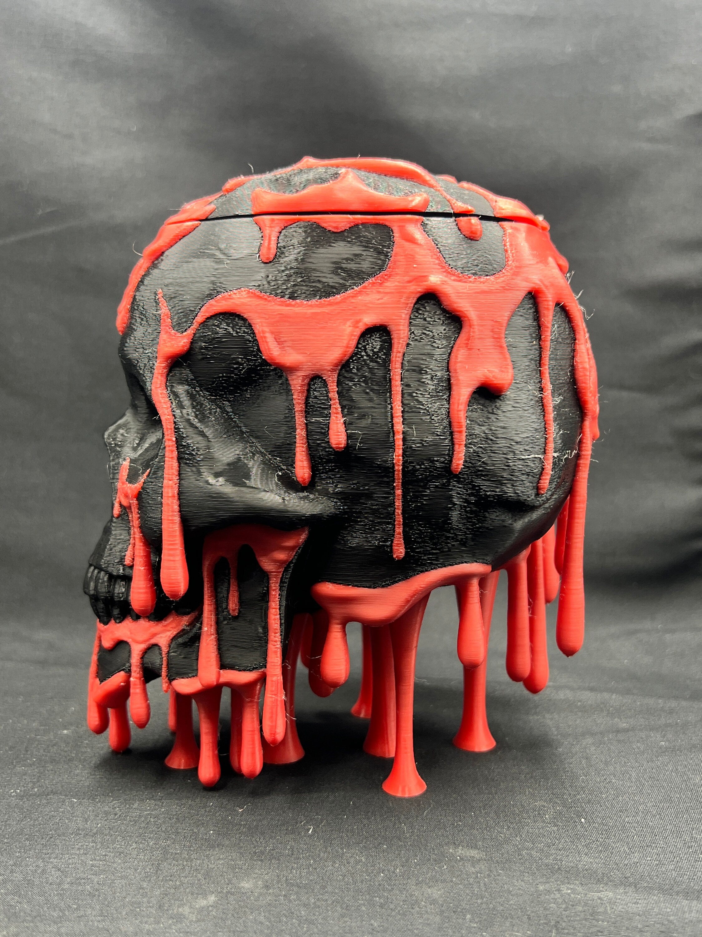 Skull Candy Dish, black with red drips, side view