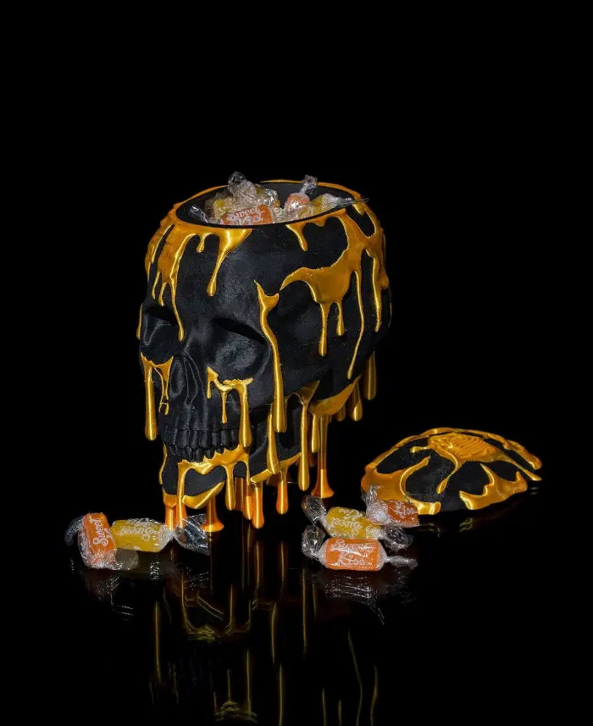 Skull Candy Dish, black with gold drips, filled with candy